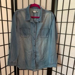 Blue denim button up shirt.